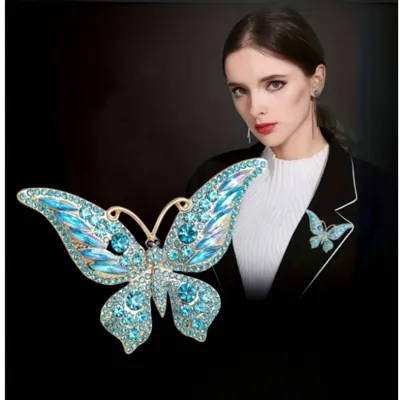 Elegantna broška z modrim metuljem 